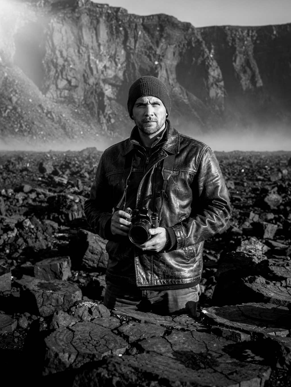 Landscape photographer in field gear during a mountain expedition
